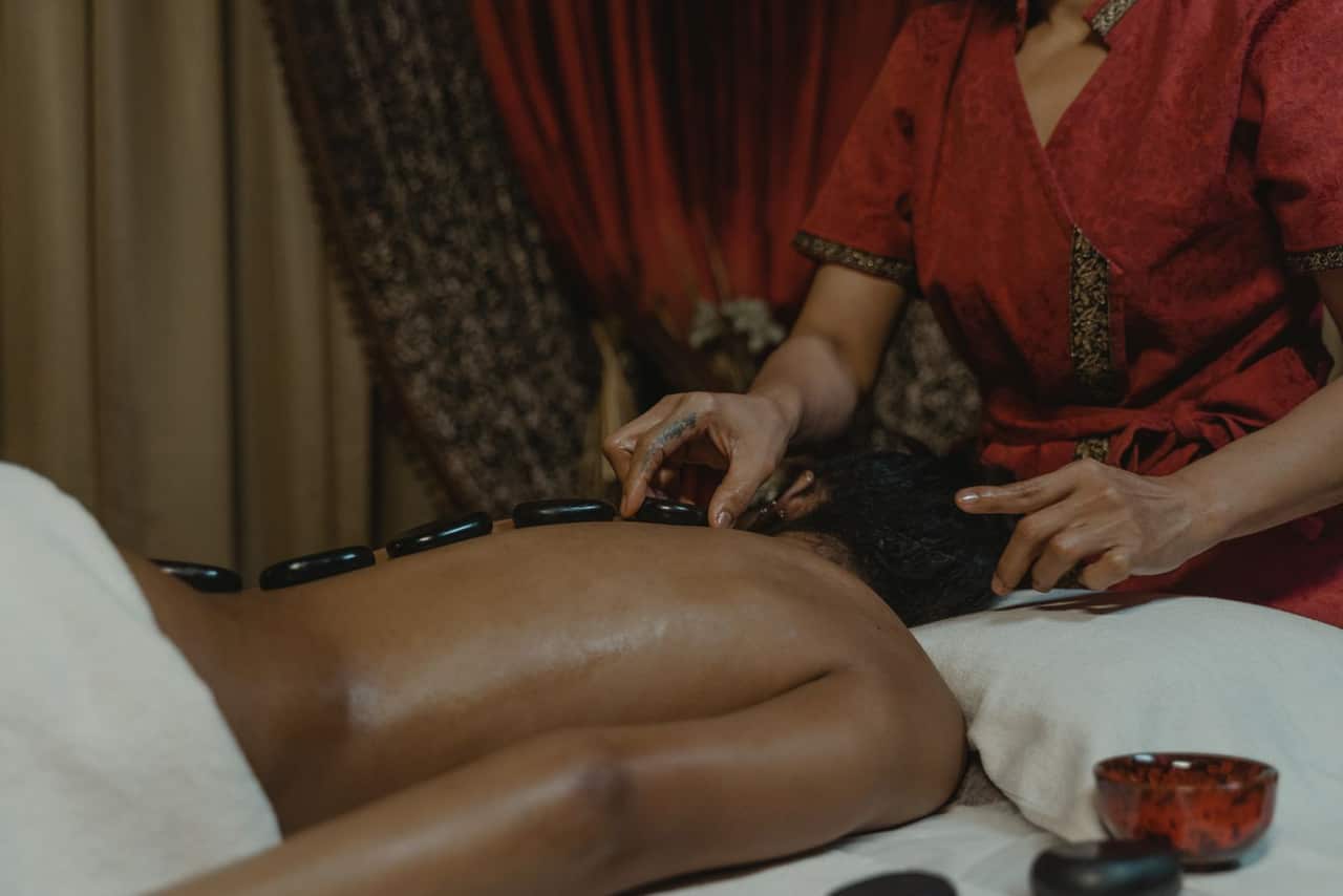 Hands-on body massage scene in an Indian wellness spa near Governorpet