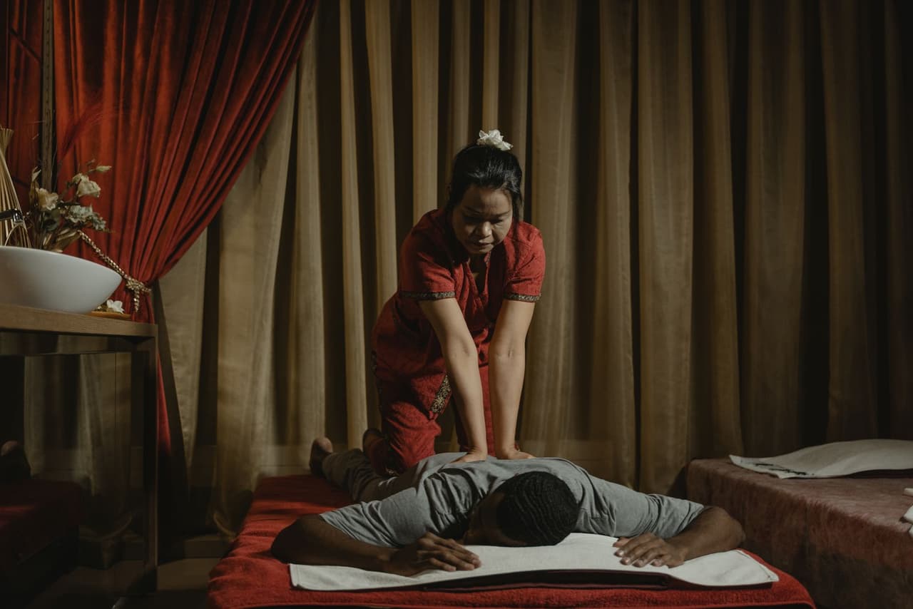 Deep tissue massage therapy in an Indian wellness spa setting