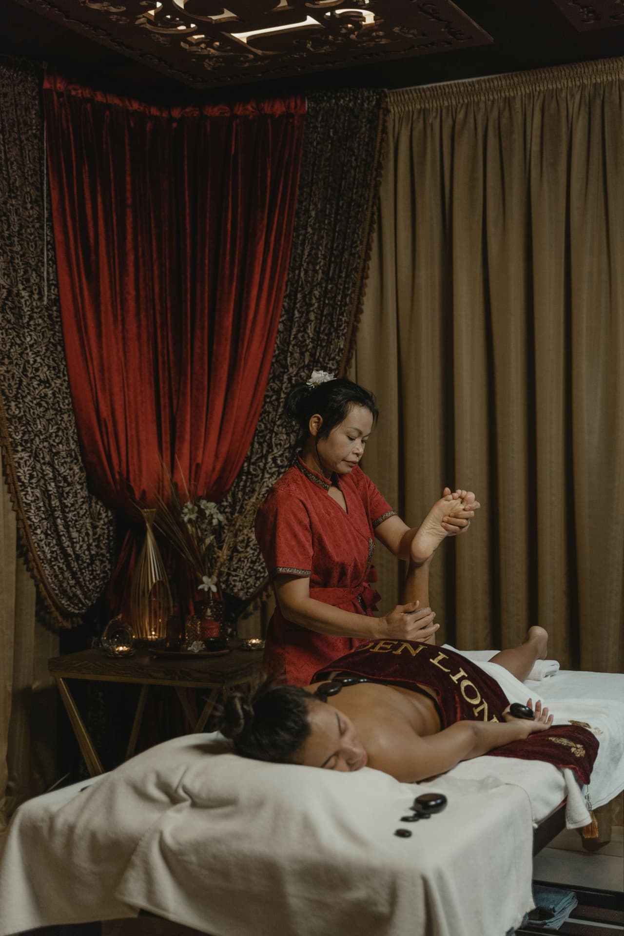 Indian wellness spa treatment scene with calming oils and candles
