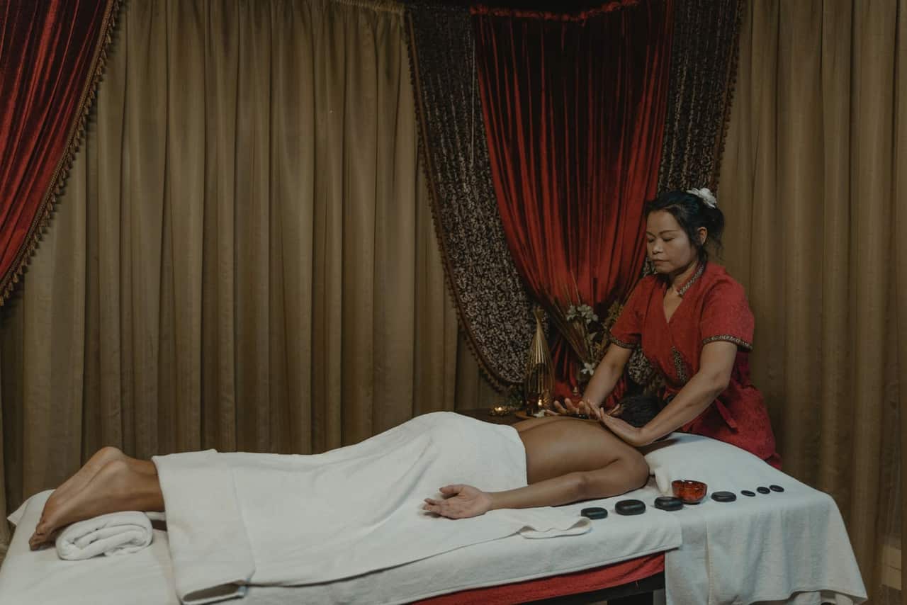 Relaxing Swedish massage session with therapist in an Indian spa room